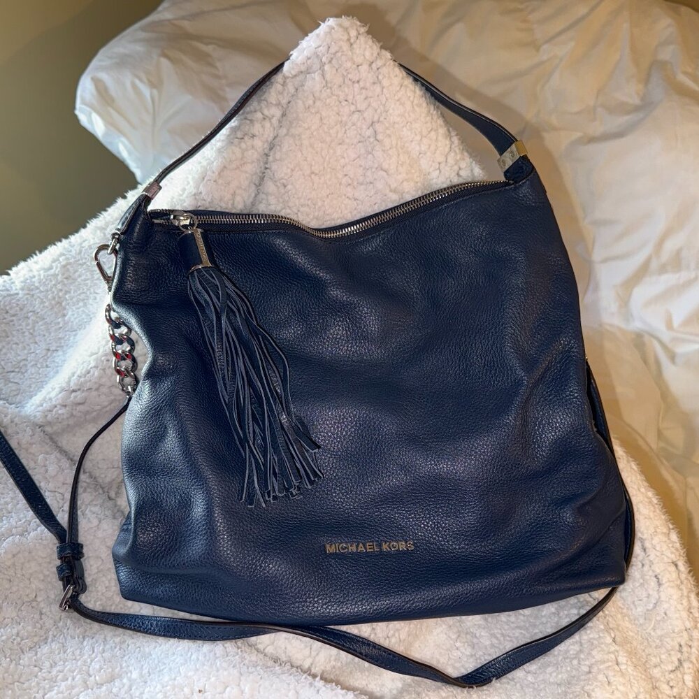 Michael Kors blue leather handbag with leather tassel like new